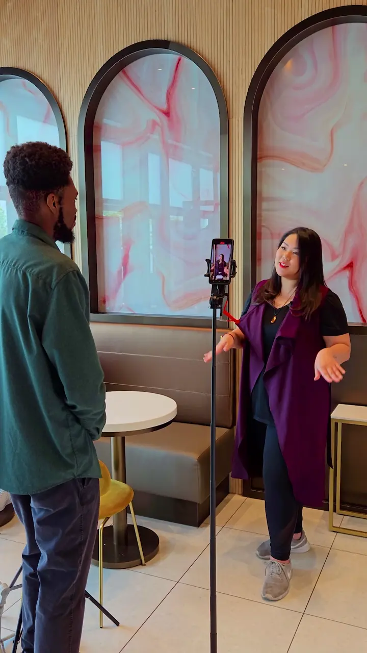 Dominic filming the owner at Evana Patisserie